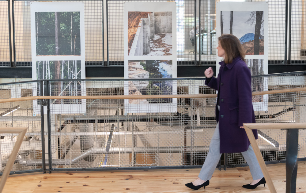 Person observing the art installed inside Kendeda