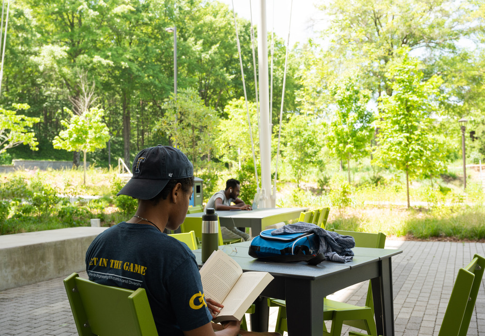 Student enjoying the porch at Kendeda