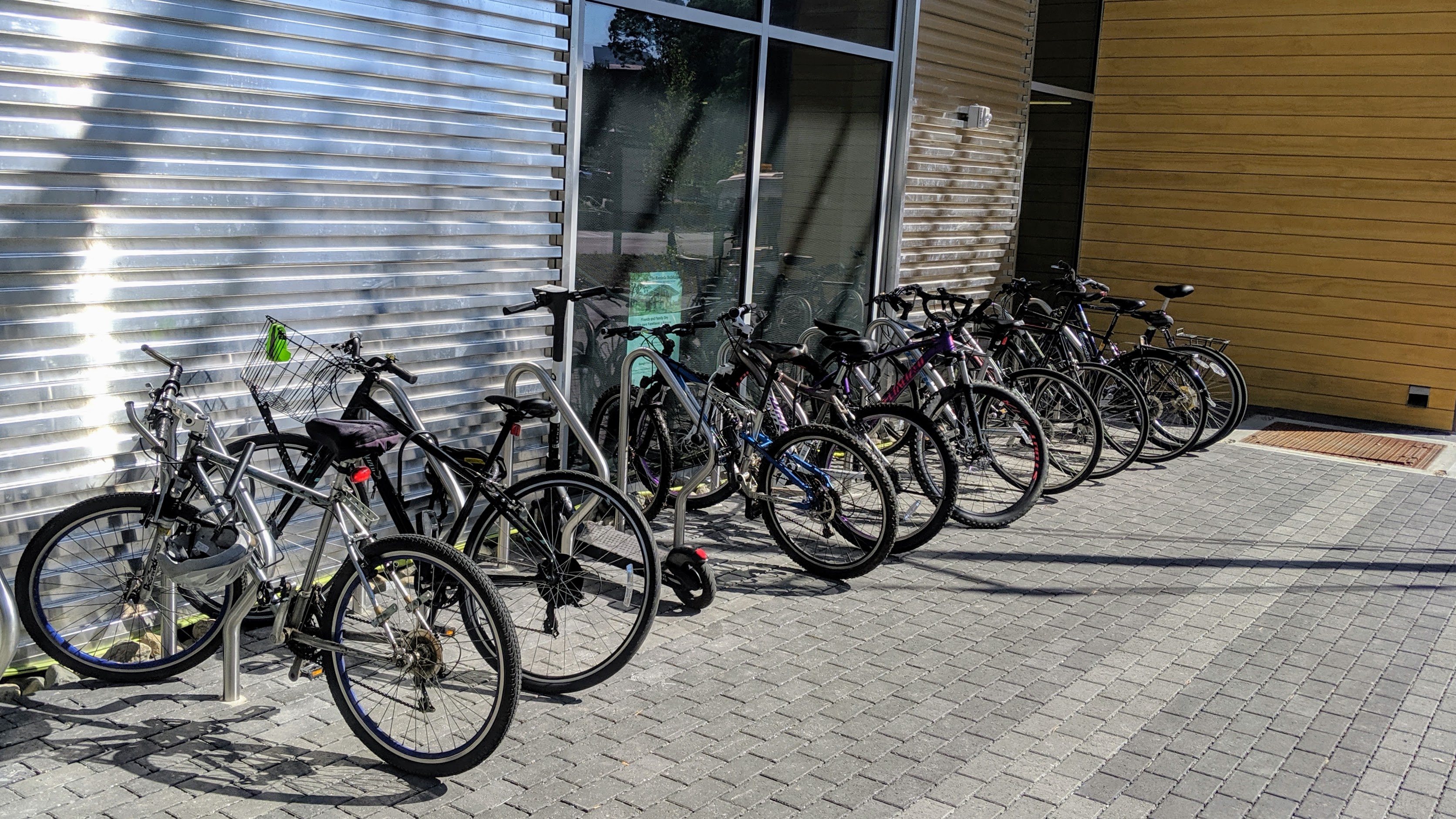 Fully utilized bike racks in front of the building.