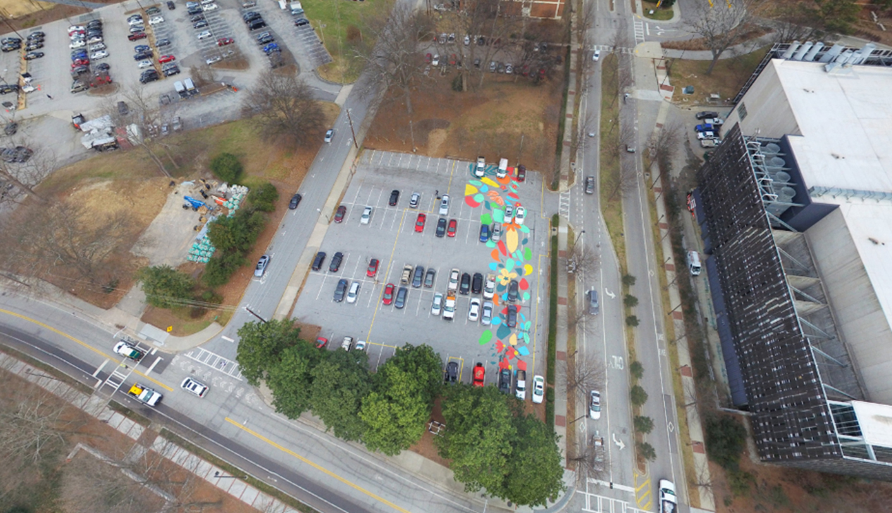 On September 8, 2017 over 50 members of the Georgia Tech community painted a mural on the future Kendeda Building site as part of the Office of Campus Sustainability’s Planting the Seeds event series celebrating the building’s launch. This event was a nod to the Beauty Petal: it educated student volunteers about the project and beautified the parking lot on which the building would be constructed.