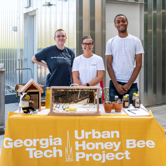 Jennifer Leavey PhD (center), the Director of the Georgia Tech Urban Honey Bee Project, with project partners.