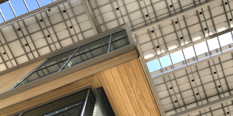 In addition to generating electricity, the solar canopy reduces energy consumption by providing shade for the building. Photo Credit: Miller Hull Partnership.