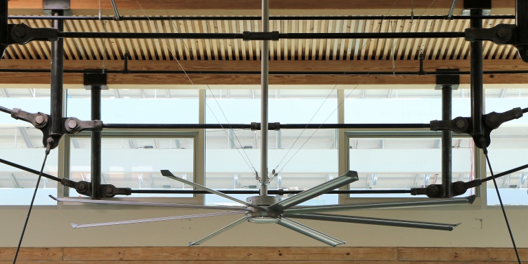 Clerestory windows and a big ceiling fan in the atrium Operable clerestory windows and a high volume, low velocity fan in the atrium.