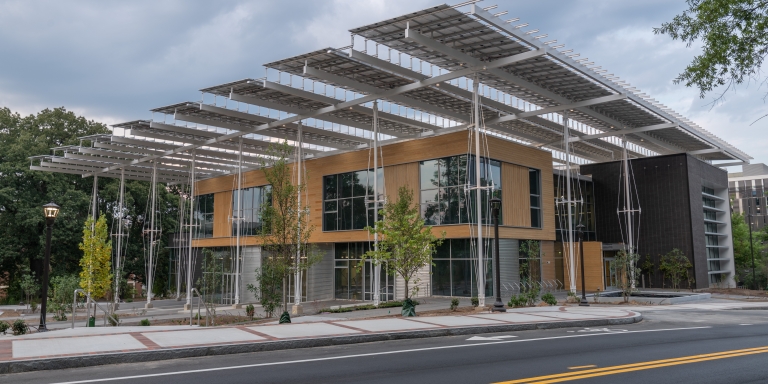 This imagine showcases two different approaches to the built environment. The street is made of impervious asphalt that turns rainfall into stormwater, which has to be channeled to sewer drains. In contrast, The Kendeda Building manages 90% of an average rainfall on-site.