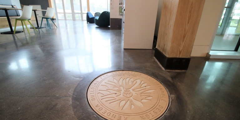 The cistern is underneath the atrium outside of the auditorium. A special cover informs occupants that they are standing on top of up to 50,000 gallons of rainwater.