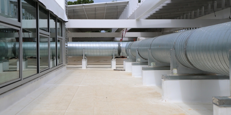 Exterior ducts transfer the fresh air from the DOAS into the building.
