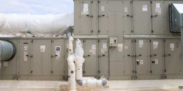 Outside air enters the DOAS through a unit that contains the thermal wheel.