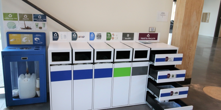 The coffee recycling station alongside one of the indoor materials management stations. The drawers can be extended to place designated hard-to-recycle products.