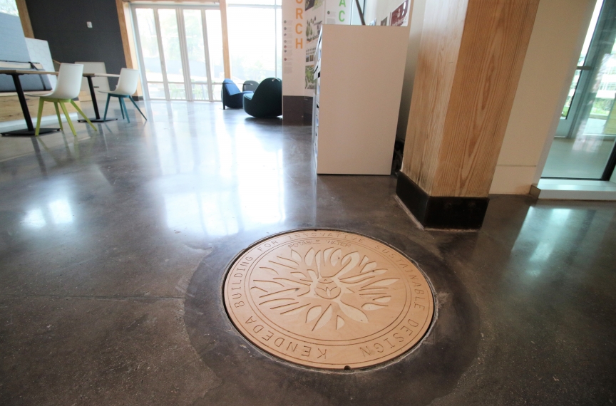 The cistern is underneath the atrium outside of the auditorium. A special cover informs occupants that they are standing on top of up to 50,000 gallons of rainwater.