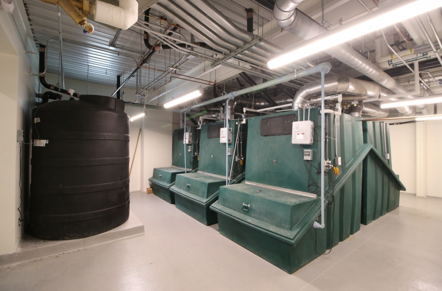 The building's six collection bins and two leachate tanks.