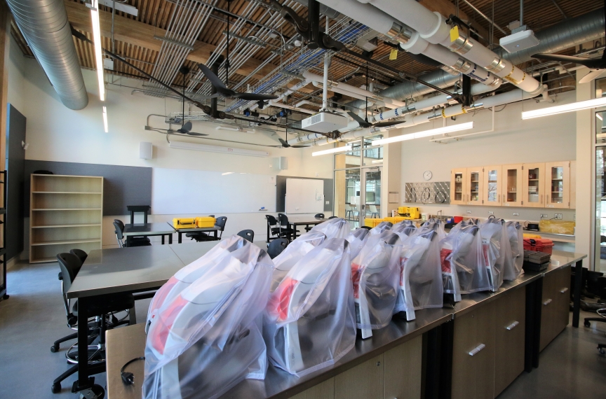 Microscopes and other equipment used for a biology class lab.