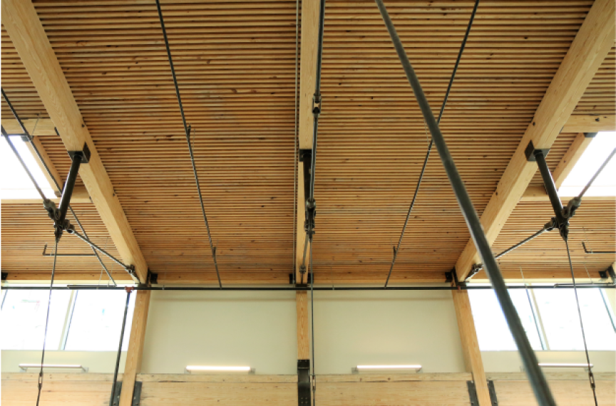 The exposed wood floor/ceiling assembly serves as a constant reminder that we can and should do more to advance equity in the built environment.