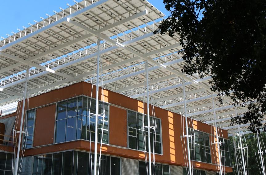The orange layer seen in this image is a fluid-applied air-and-water barrier made by a company that specifically removed red-list materials from its product in order to comply with the Living Building Challenge.